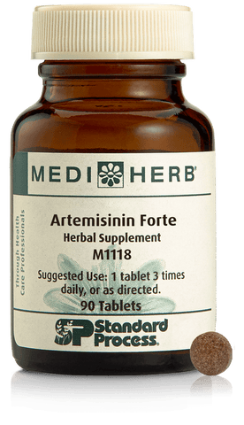 - A bottle of Artemisinin Forte next to a tablet.