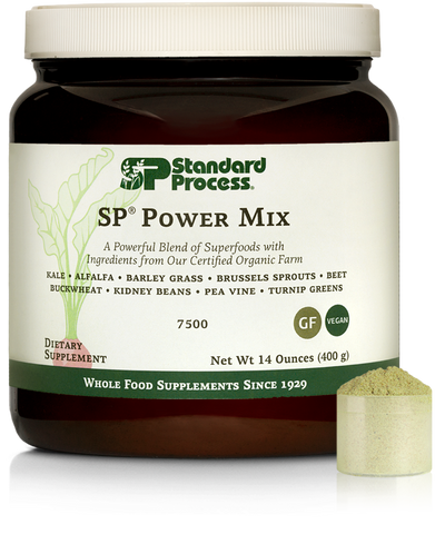  - Tub of SP Power Mix next to a scoop of the green powder.