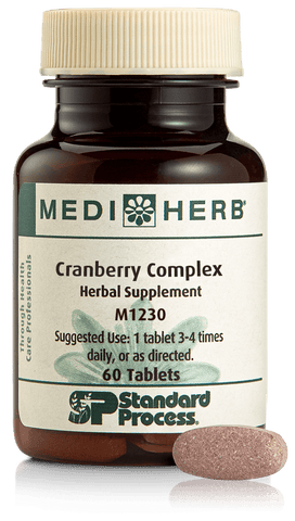  - A bottle of Cranberry Complex next to a tablet.