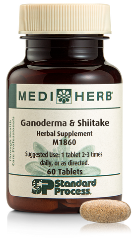  - A bottle of Ganoderma & Shiitake herbal supplement next to a tablet.